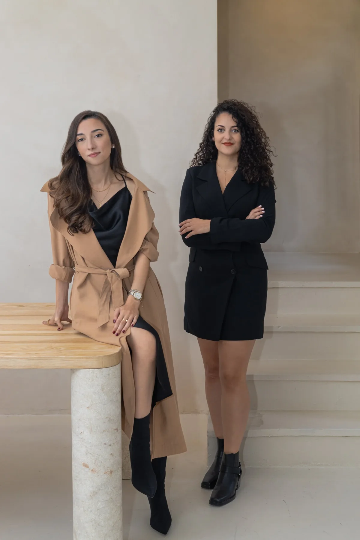 The two founders of Twyst Interiors, photographed at the studio in Dubai